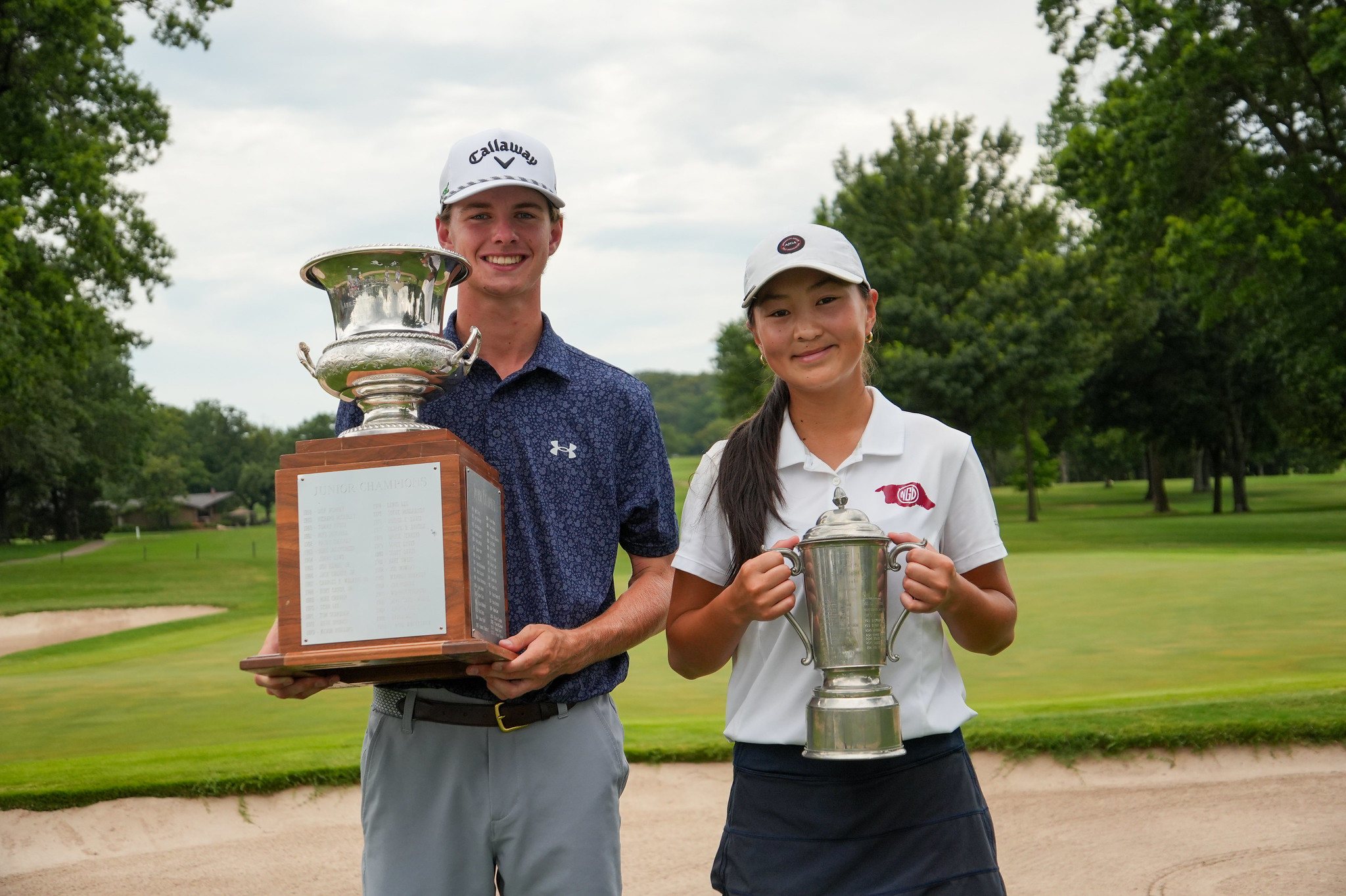 champions-holding-trophies